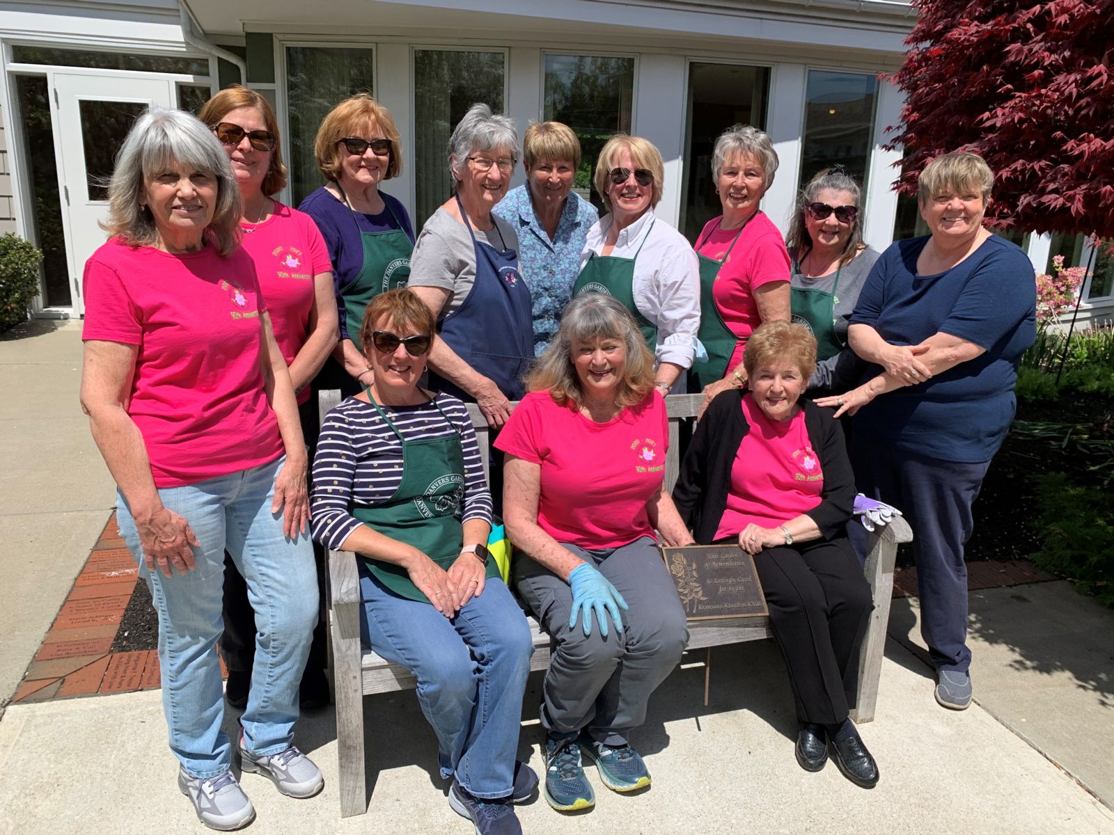 The Danvers Garden Club volunteers at the Kaplan Family Hospice House: back row, L to R: Club President Lori Estes, Vice President Ann Farley, Marguerite Parkman, Kathe Hyland, Anne Sweeney, Judy Drouin, Lauren Yeannakopoulos. Front row: Mary Giangregorio, standing left; Patty Chisholm, Joni Pesola and Evie Fraser seated on bench; and Nancy Sweeter, standing right.