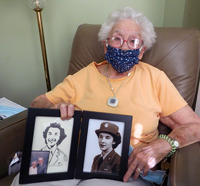 Claire White displays a drawing and photo of herself as a member of the U.S. Women’s Army Corps.