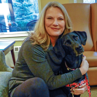 Lisa volunteered at Care Dimensions' Kaplan Family Hospice House in Danvers, sharing her beloved dog Chloe with patients.