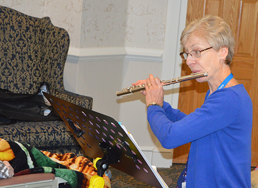 Cindy Shupp, Hospice Volunteer, shares her musical talents with a hospice patient in a long-term-care facility