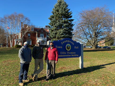 Gino Cresta, Swampscott DPW director, right, with DPW staff Mike Chakoutis, left, and Nick Conti in front of the Tree of Lights.