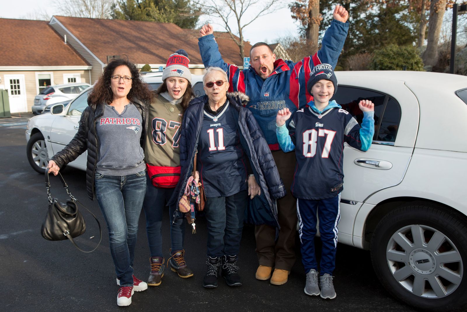 Joan McLynch with her family as they prepare to leave for the New England Patriots game at Gillette Stadium