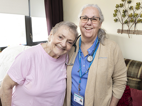 Care Dimensions RN Case Manager Maureen Macaro visits with one of her patients, Linda Bain of Wakefield, Mass.