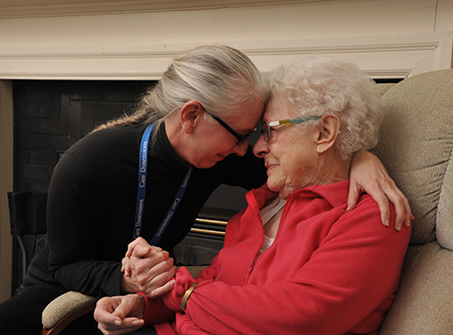 Care Dimensions massage therapist Alison Powers shares a tender moment with her mother, Beverly, who receives hospice at home.