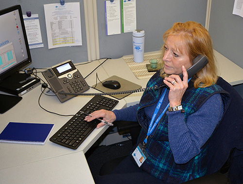 Care Dimensions Confidence Liaison Diane Theriault makes a check-in phone call to a hospice patient.