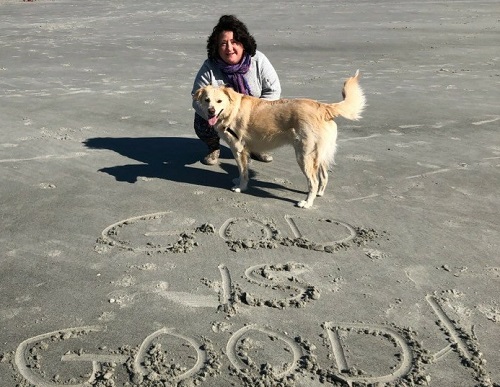 Care Dimensions Senior Chaplain Rona Tyndall cares for her spirit during the COVID-19 pandemic by walking on the beach with her dog.