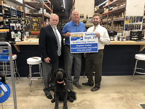 David Delande (left) with his pet therapy dog, CoCo, and his brother, Rick, and son, Matt, get ready for the Care Dimensions Walk for Hospice.