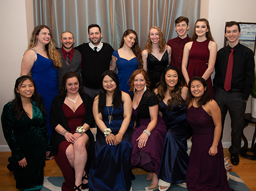 Friends and family gather with Eliza Mager (first row, third from left) for a birthday-prom event. Eliza, who is receiving hospice care, was unable to attend her high school prom due to cancer treatments.