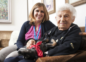 Care Dimensions social worker Laci Gentry with hospice patient and pet therapy dog