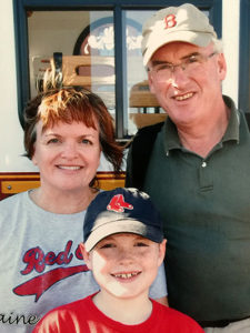 Julie with her husband Rick and son Colin attended a Seadogs game in Portland, ME. It was to be their last family photo as Rick died in October 2011.