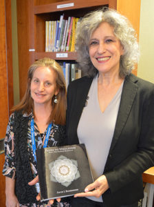 Barrie Levine donates book to Care Dimensions' Ellen Frankel at Kaplan Family Hospice House
