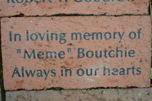 Inscribed brick honoring Meme Boutchie