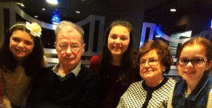 Norman Brown and his wife, Dolores, at a family gathering with great-granddaughters Caitlin (left) and Molly (right), and granddaughter Olivia (center).