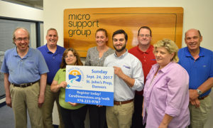 Bruce Billingham (far right), president of Micro Support Group in Beverly, MA, is joined by employees who support Team Cindy and the Care Dimensions Walk for Hospice. His daughter, Dayna Morton, is fourth from left.