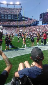 Tom Brady and New England Patriots take field Care Dimensions hospice patient Steve Brown watches