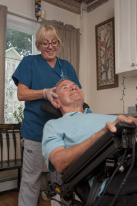 Hospice patient John Driscoll receives head and neck massage from Care Dimensions massage therapist