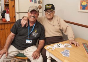 Care Dimensions Veteran-to-Veteran volunteer with hospice patient after a game of cribbage