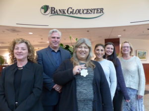 BankGloucester President Patrick Thorpe and staff gather to remember co-worker Avis Beaulieu, who received hospice from Care Dimensions.