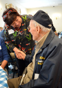 Care Dimensions President Pat Ahern thanks long-time hospice veteran-to-veteran volunteer Tom Pendergast at a volunteer appreciation dinner.